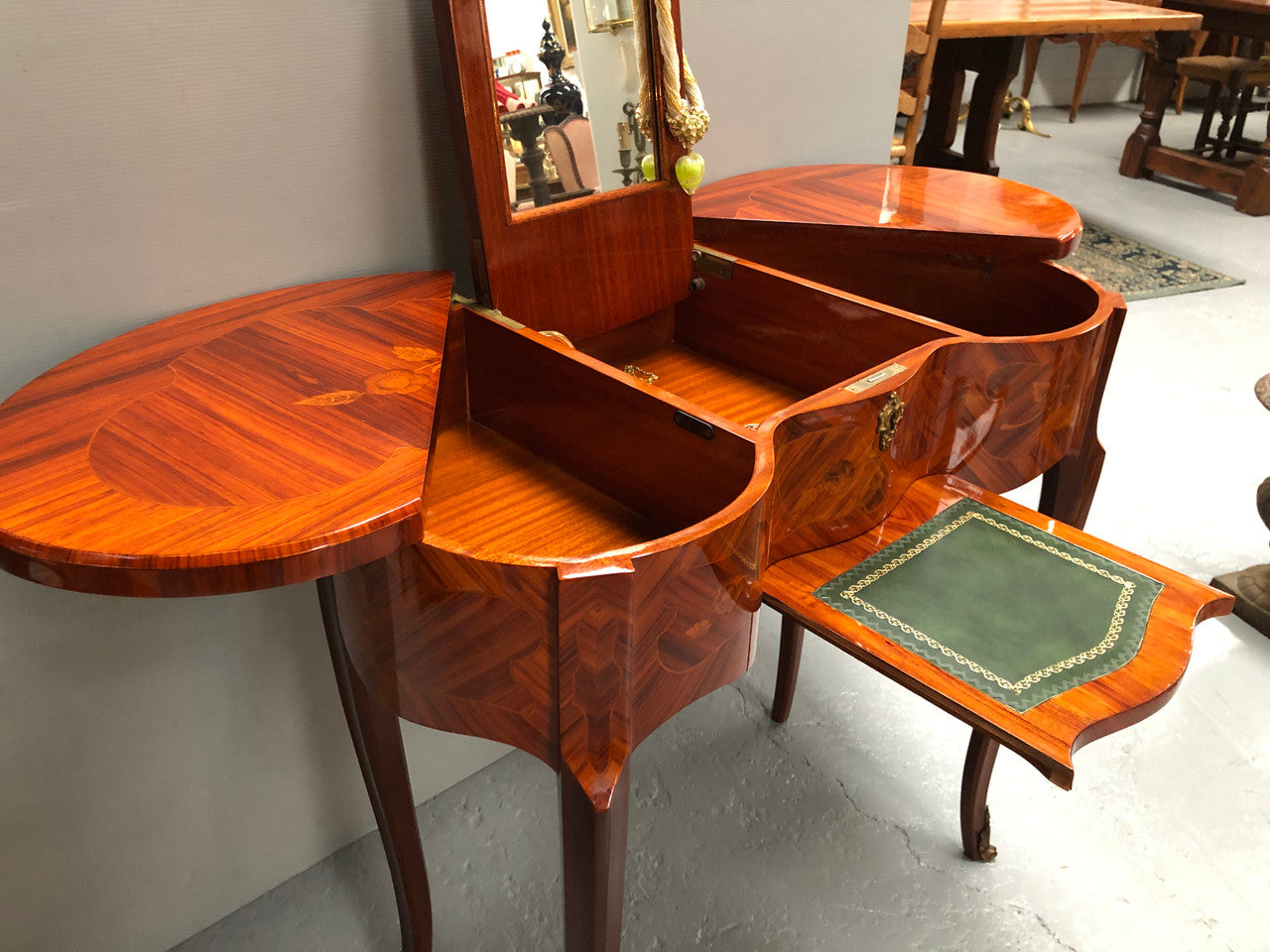 French Mahogany hidden dressing table with beautiful marquetry inlay. In good restored condition. Circa: 1950's