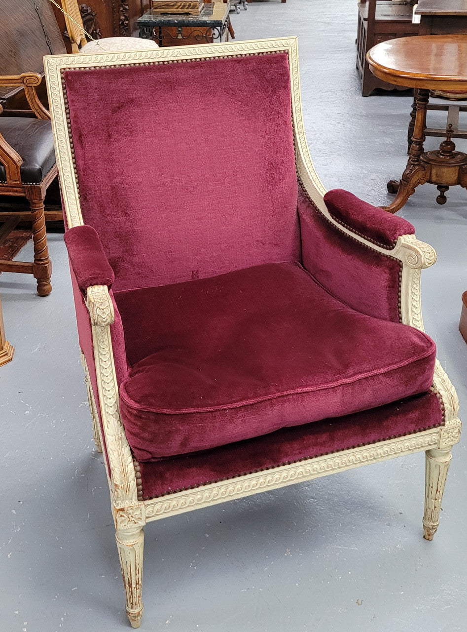 Louis 16th Style high back upholstered chair with maroon velvet fabric, decorative carvings and original paint. It has been sourced from France and in good original condition.