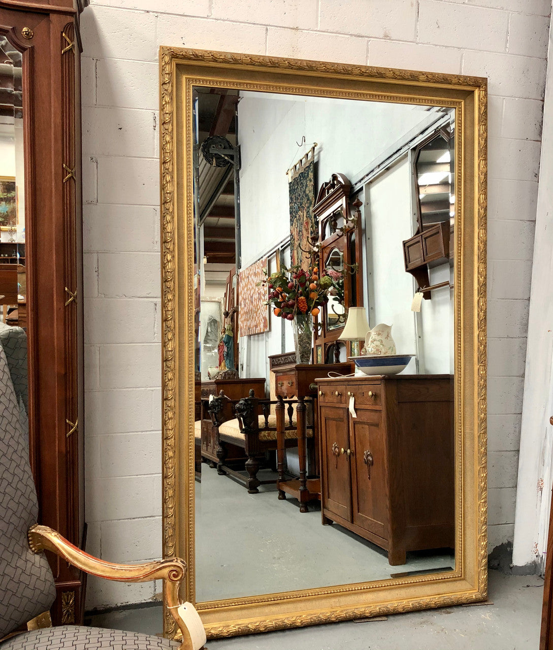 Very large French style mirror with beveled glass. In very good original condition.