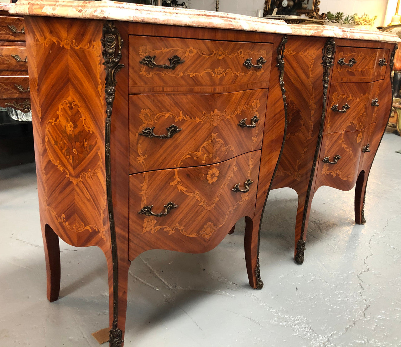Rare Pair of French miniature commode bedsides with beautiful marquetry inlay & ormolu mount. Circa 1950's and are in very good condition.