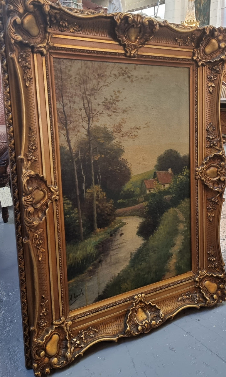 Lovely signed landscape river scene oil on canvas framed in a beautiful ornate frame and in good original condition.