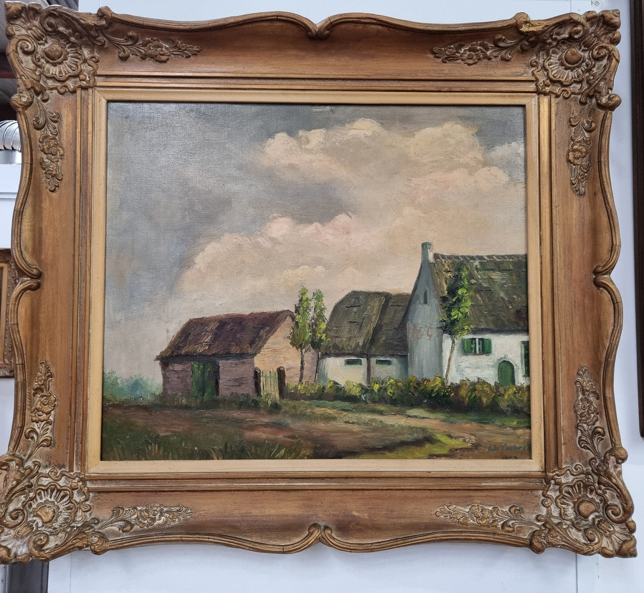 French signed oil on canvas depicting farmhouse in a lovely gilt frame. It is in good original detailed condition and has been sourced from France.