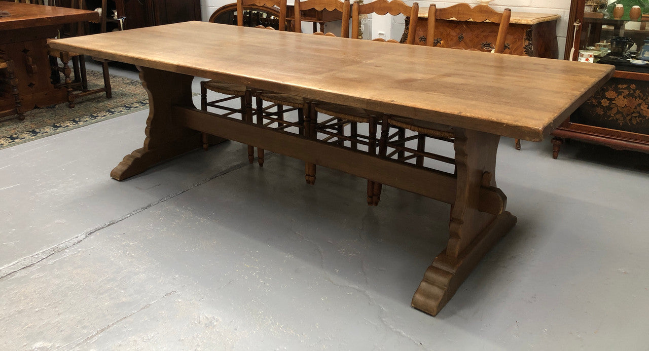 Lovely long French light oak Farmhouse table with a good thick plank top and beautiful stretcher base. Can seat 12 people very comfortable and is in good original condition.