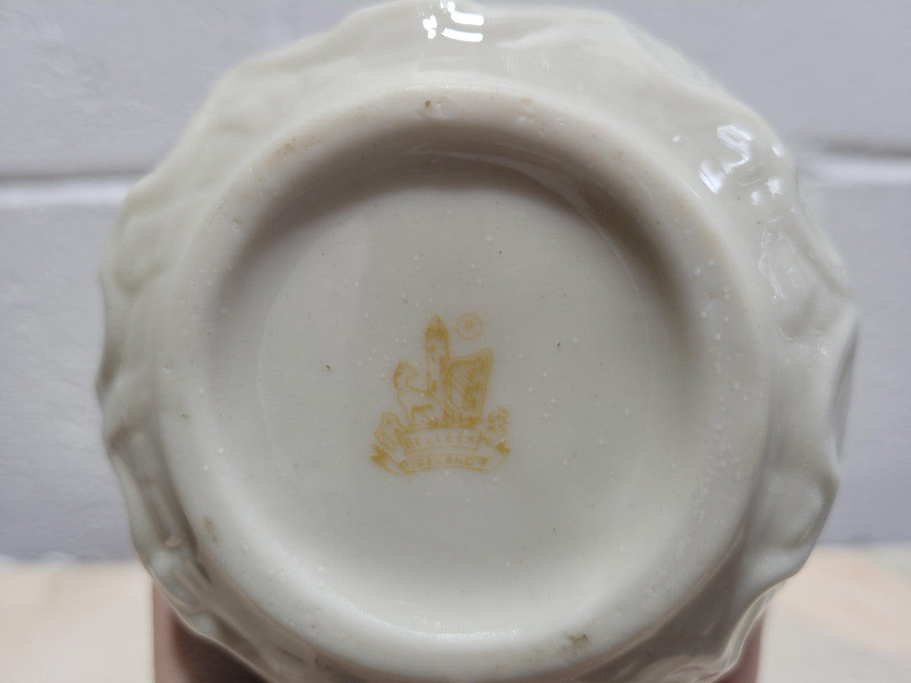 Vintage Belleek Double Handled Fish Vase. Scalloped shell pattern on base & delicate fish handles. Brown Mark 1980 – 1933.