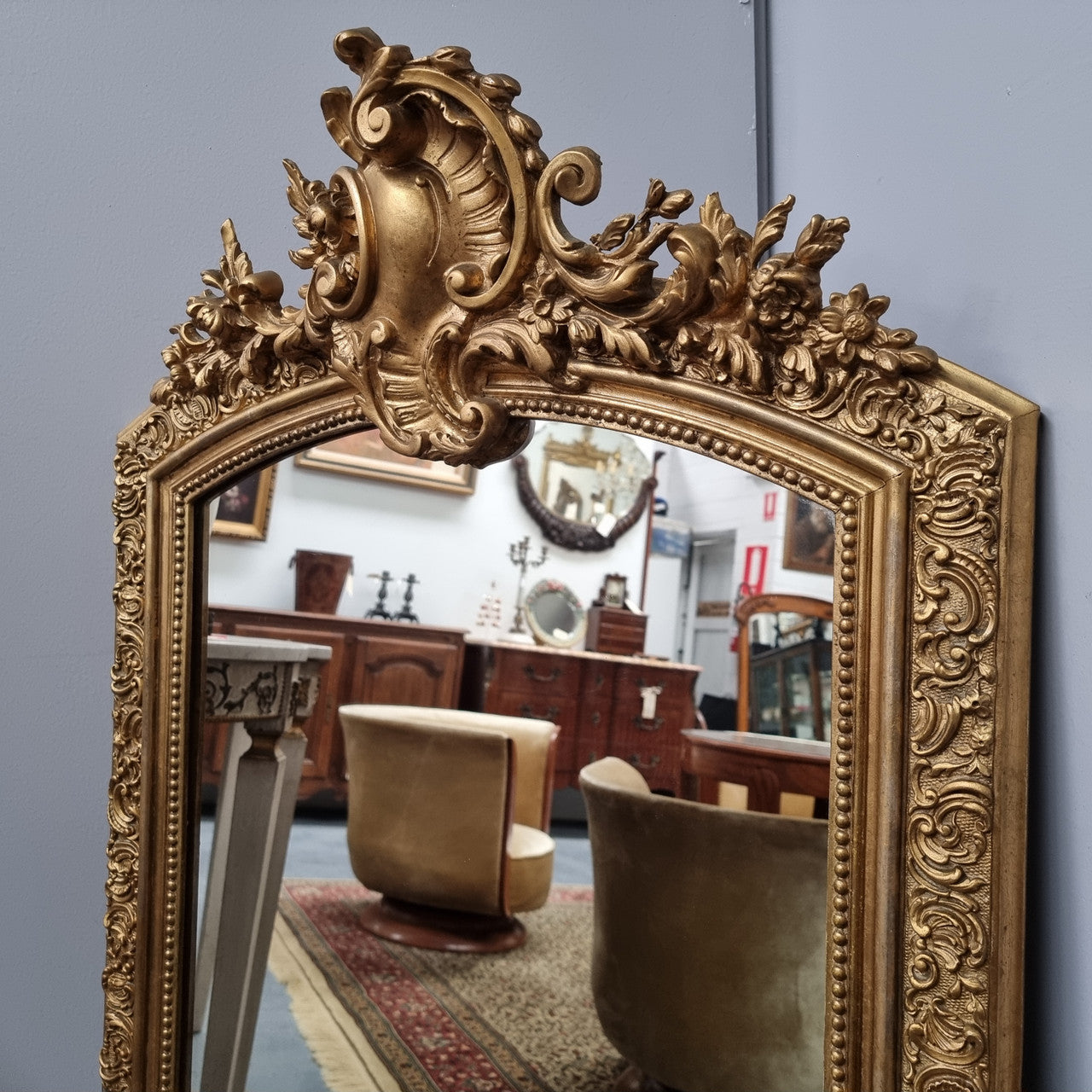 Late 19th Century French Louis XV style carved gilt wall mirror. Sourced from France and in good original detailed condition.