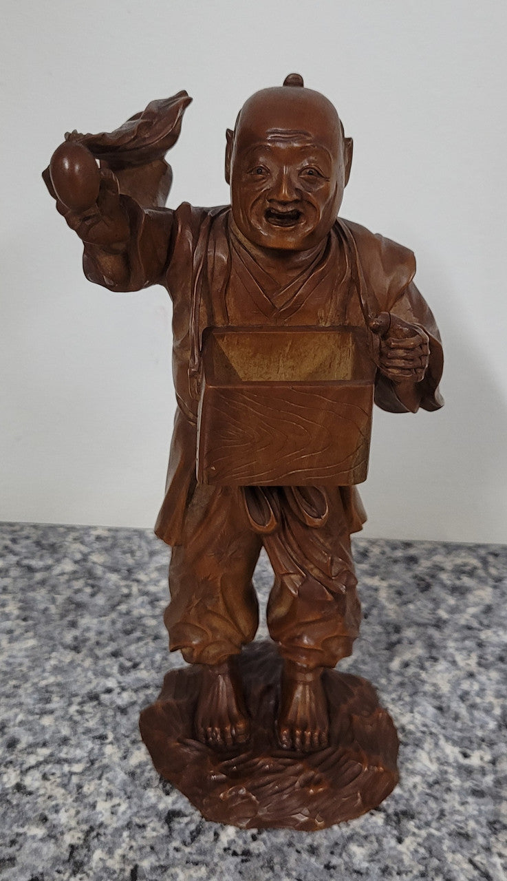 Exceptional Japanese Meiji period boxwood carving of a Peach Seller. Circa 1880's and it is signed to base. It is in good original condition, please view photos as they help form part of the description.