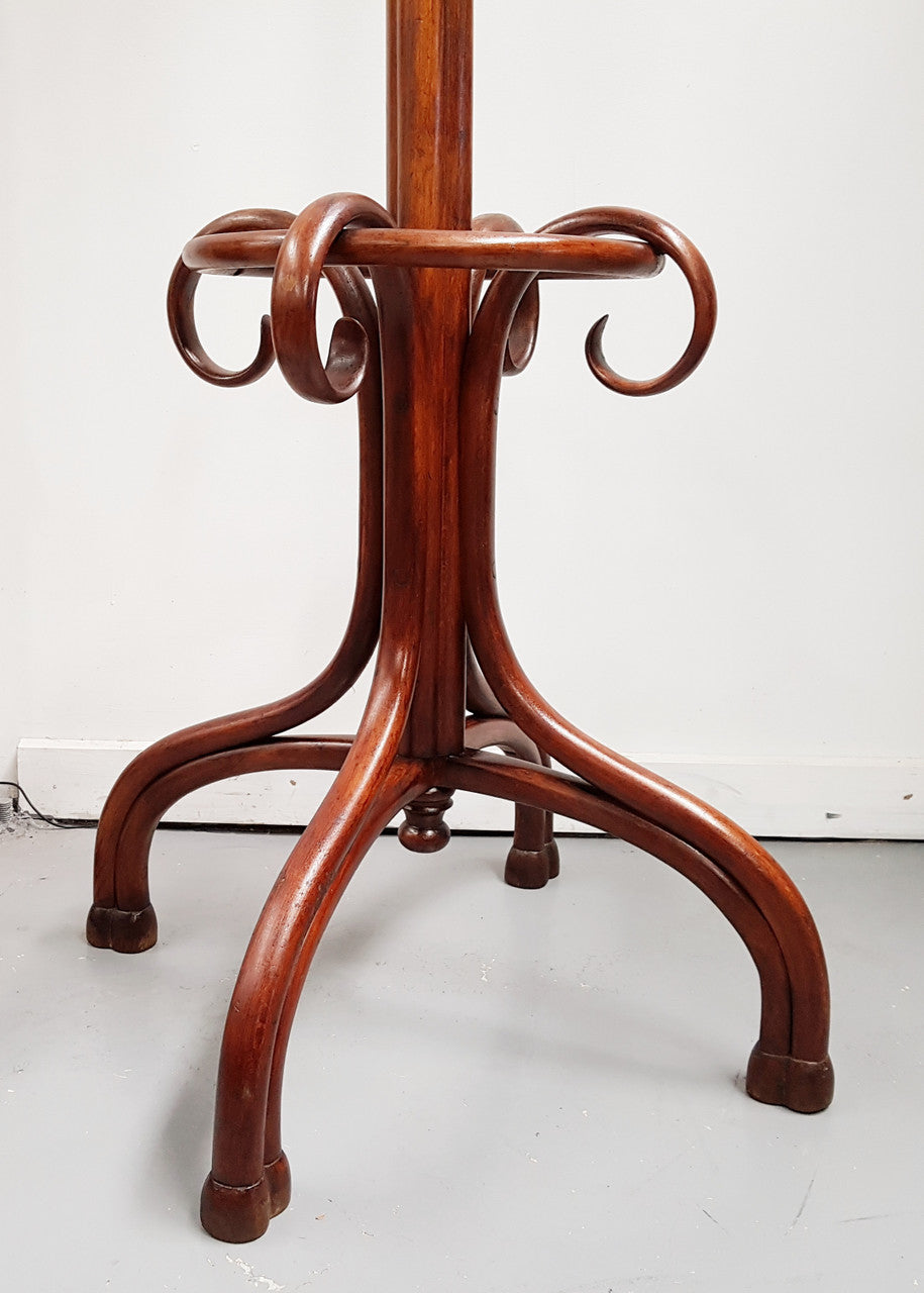 A great example of an Antique French walnut stained Thonet style hat and coat stand in very good restored condition. Very sturdy and solid. Hard to find. Circa 1900.