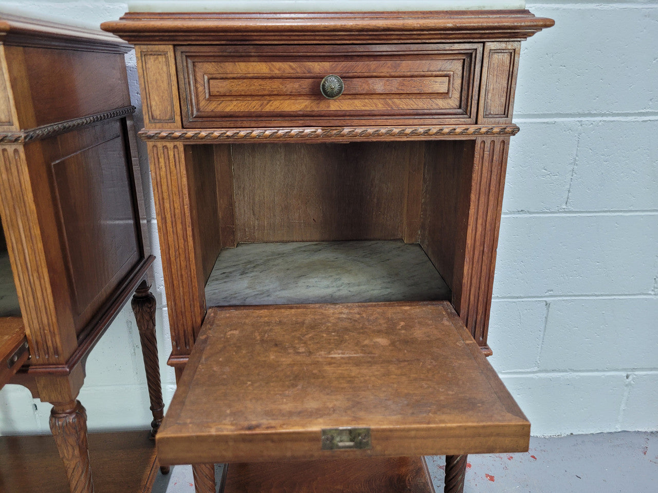 Pair parquetry Walnut bedside cabinets with white inset marble tops. In good original detailed condition.