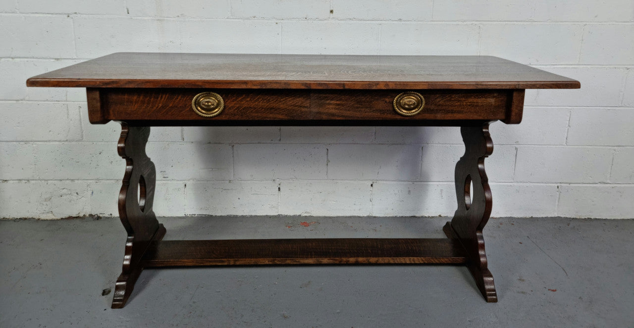 French dark Oak two drawer console table. It has loads of character and is in good original detailed condition.