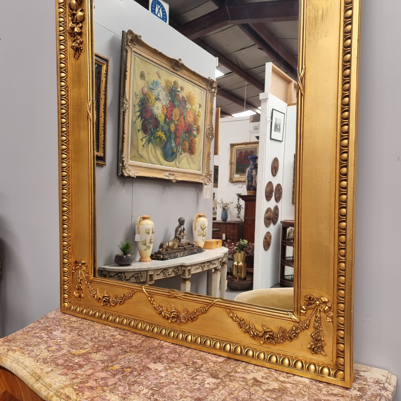 Stunning Vintage French floral gilt framed overmantel mirror. It has been sourced from France and is in good original detailed condition.