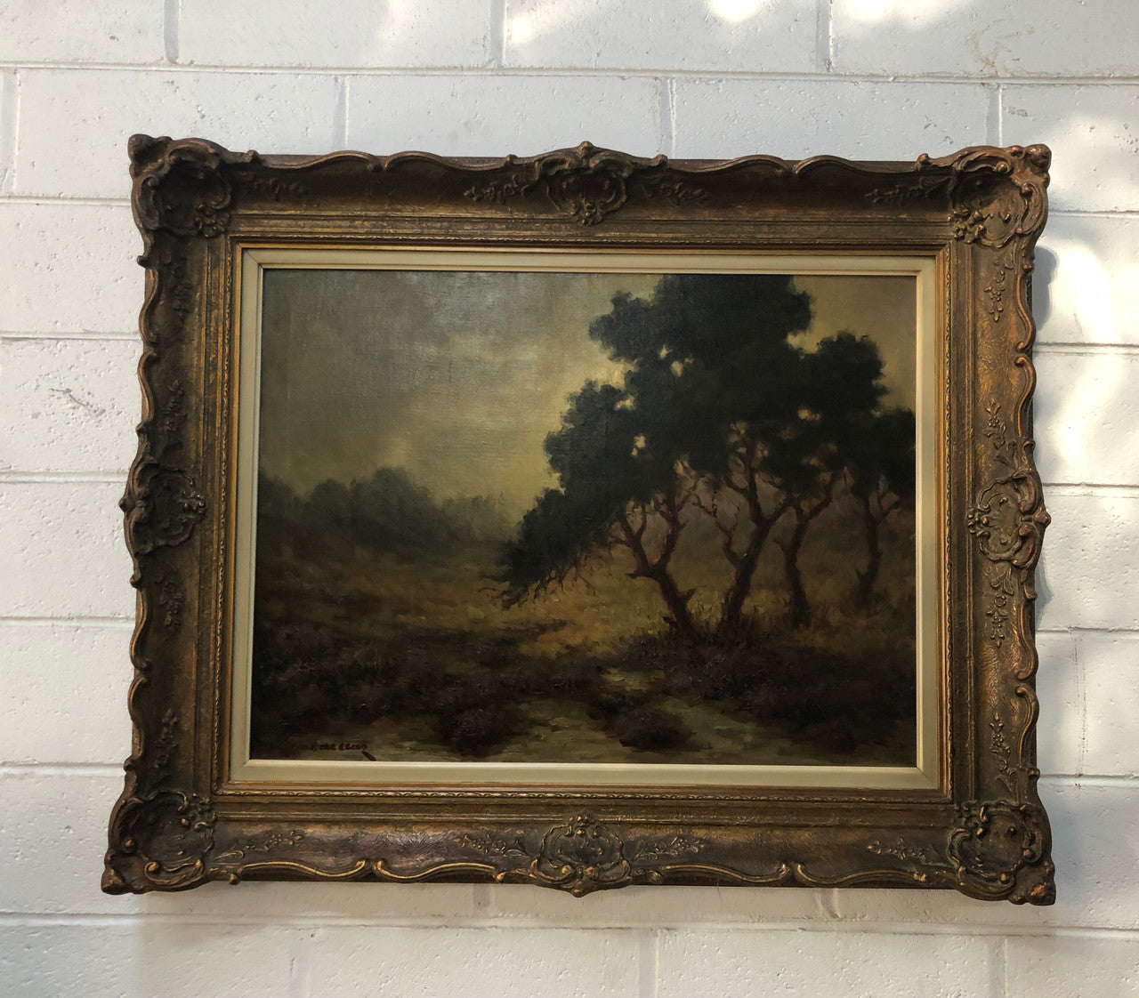 Sensational "Moody" oil on canvas landscape painting in a ornate gilt frame. In good original condition.