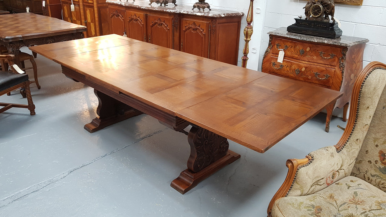 A beautiful French oak, Spanish style parquetry top extension table, with amazing carving and lovely details in very good condition.