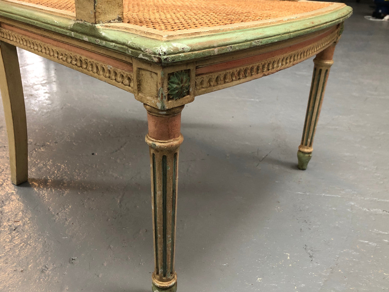 Painted French Louis XVI style cane panel arm chair. Paint is original and it is in very good original condition.