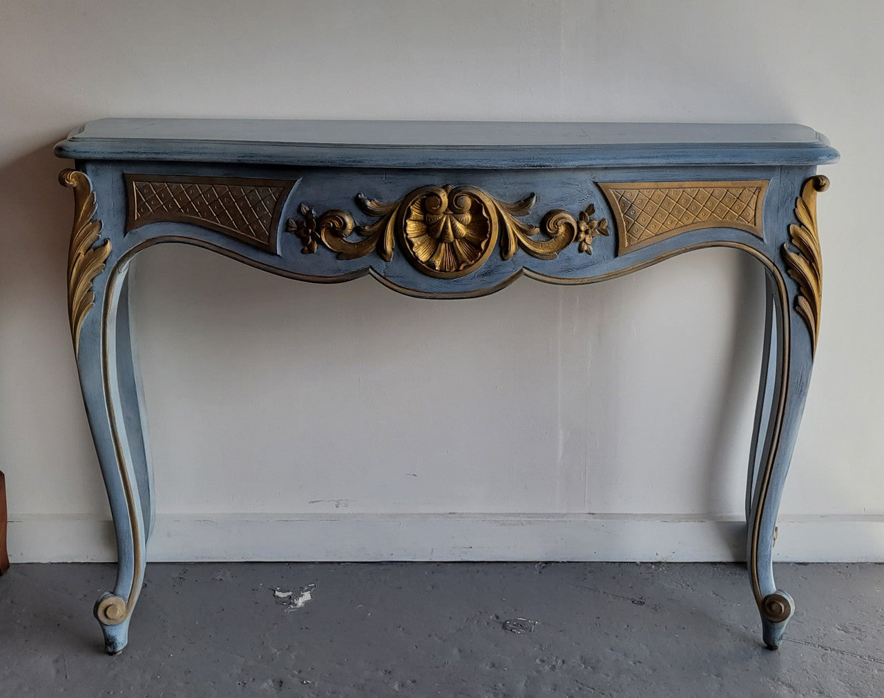 Stylish Louis 15th style console table with chalk paint and gilded highlights. They have been sourced from France and is in good original condition.