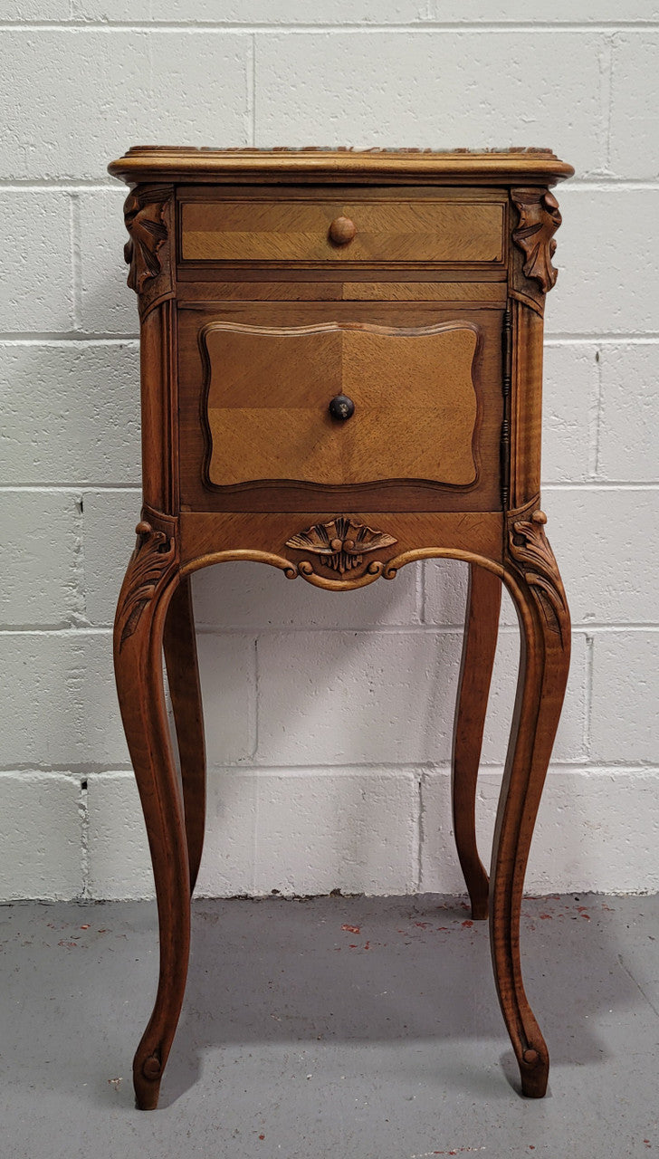 Single French Louis XV style Walnut inset marble top bedside. It has one drawer and one cupboard. It is in good original detailed condition.