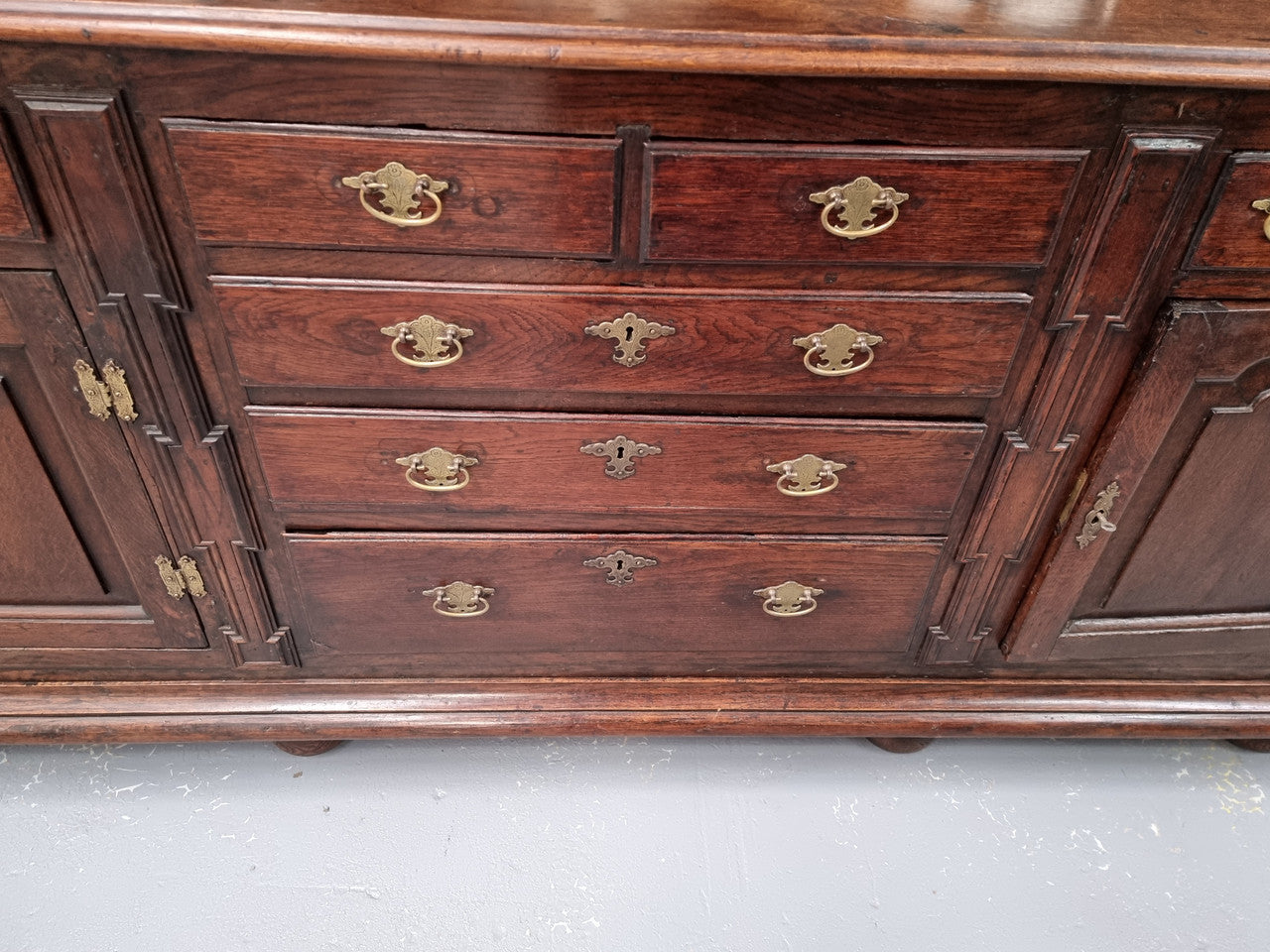 18th Century English Oak Farmhouse dresser of grand proportions. It was sourced in France and not only looks amazing but also has plenty of practical storage space. It is in good original detailed condition.