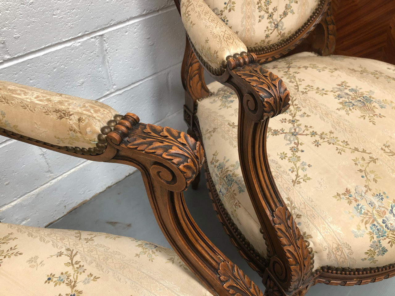 Pair of Antique French Louis XVI style carved Walnut fauteuils in restored condition. The Tapestry upholstery is in good condition some marks and wear but usable.
