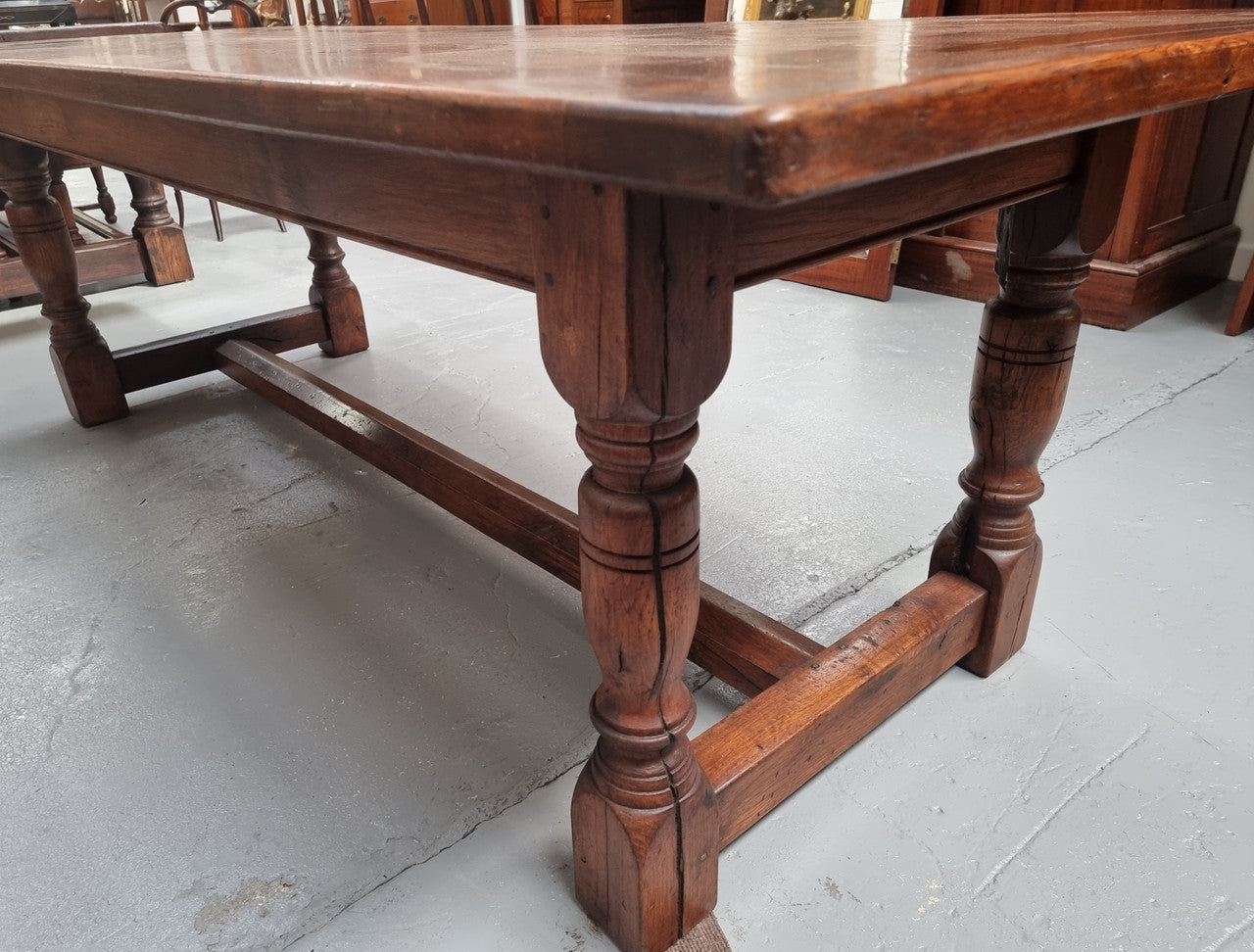 Vintage French Oak stretcher base farmhouse table. It is in good original condition.