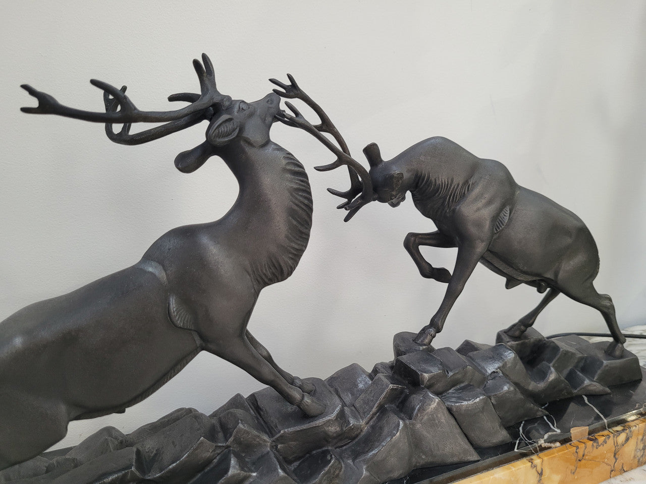 French Art Deco bronzed spelter and marble"Fighting Stags" statue by renowned artist and sculptor "Irenee Rochard".