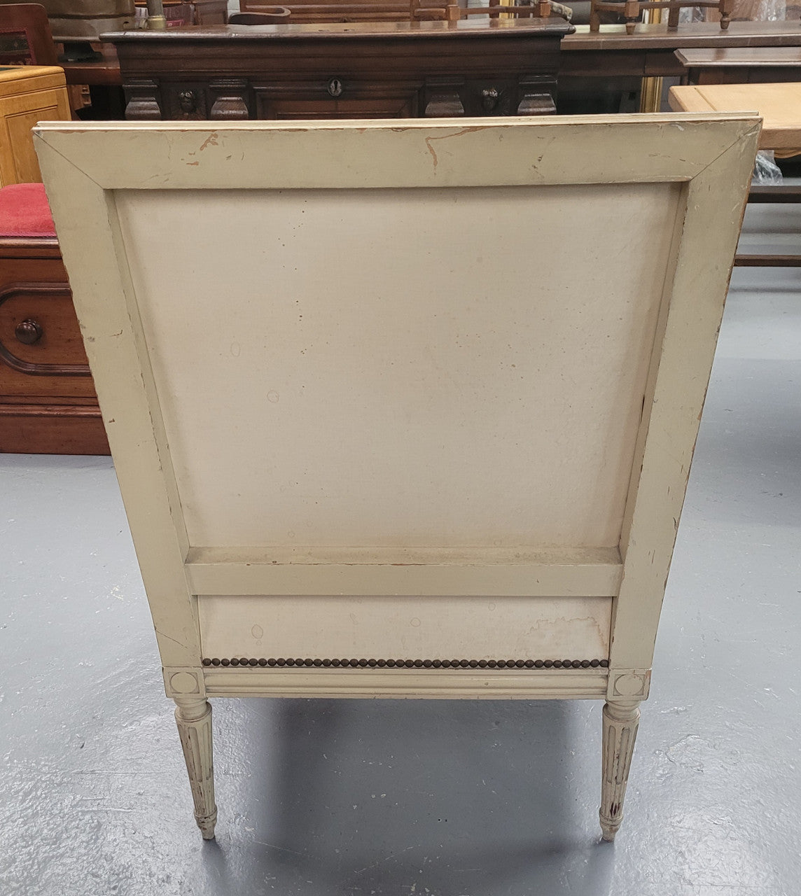 Louis 16th Style high back upholstered chair with maroon velvet fabric, decorative carvings and original paint. It has been sourced from France and in good original condition.