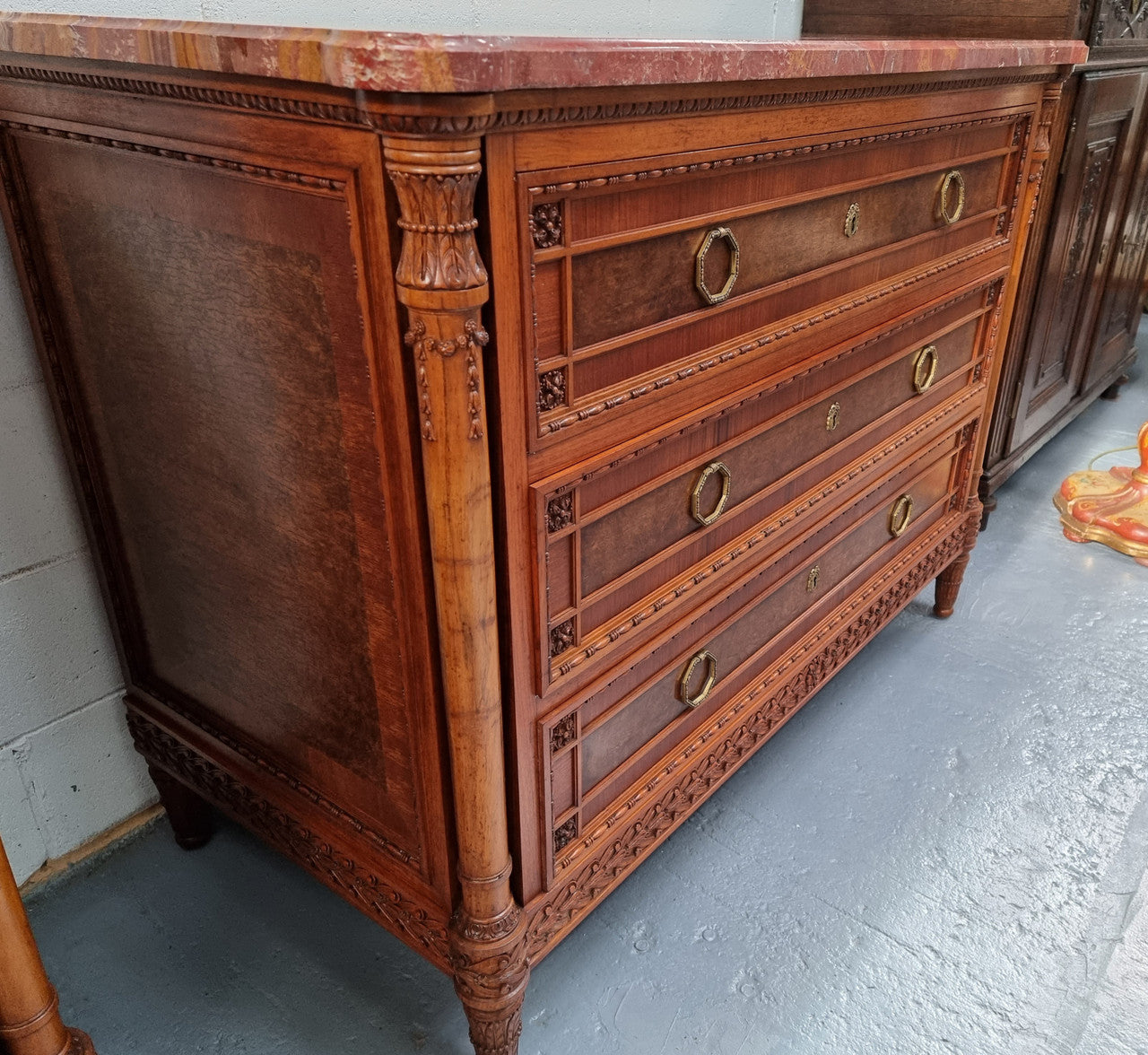 Lovely decorative French walnut and burr Walnut 3 drawer commode with a stunning coloured marble top and lovely carved details. In very good detailed condition.