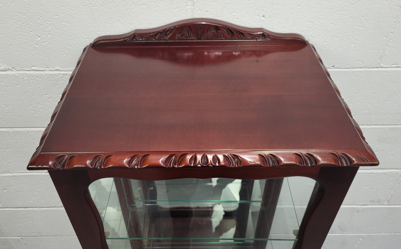 Vintage Mahogany petite display cabinet with three solid glass shelves. Ideal for a small area and is in good original detailed condition.