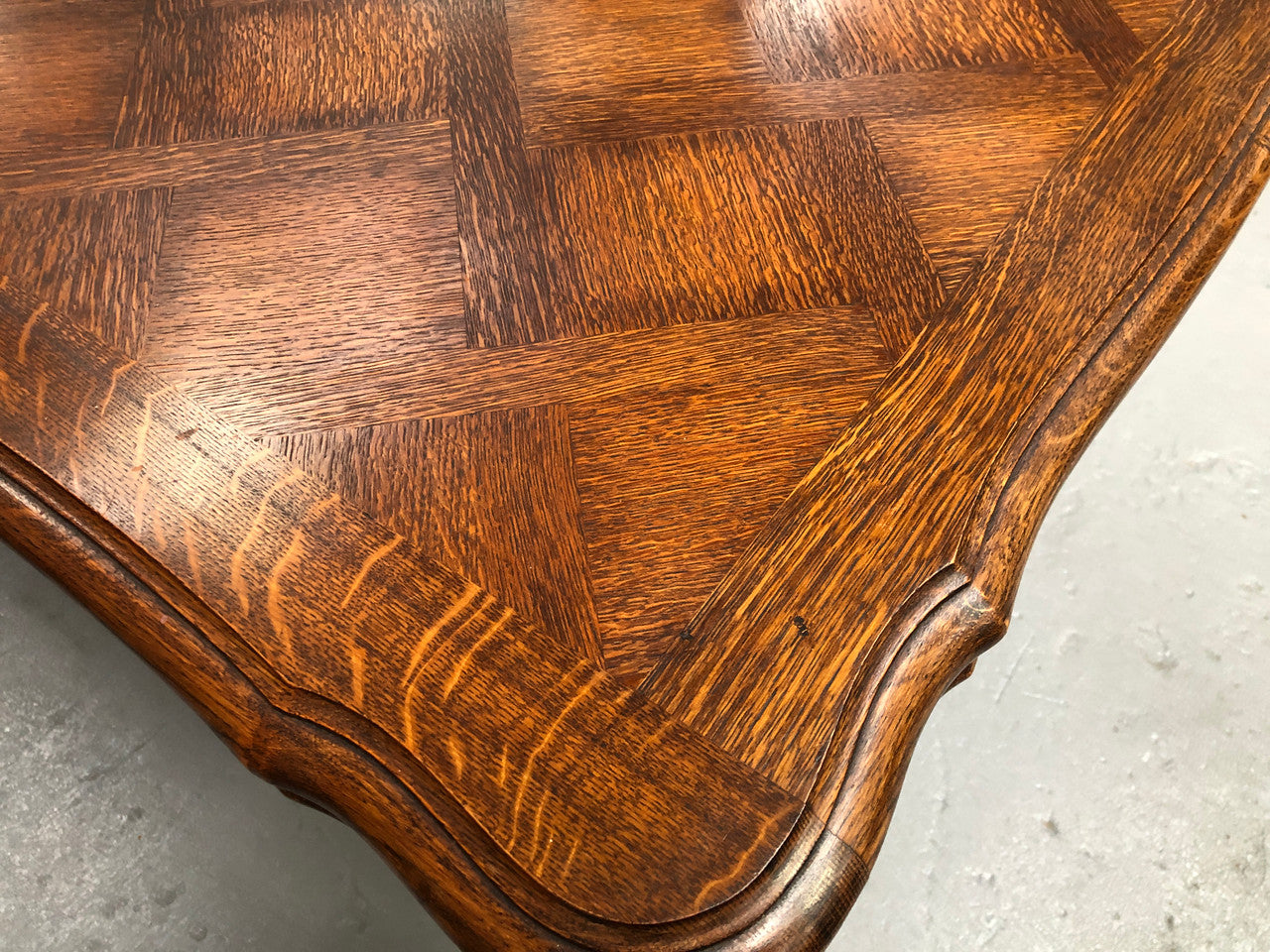 High quality French Oak Louis XV Style, beautifully carved extension table. It has an amazing parquetry top and when fully extended measures to 3 meters long. In very good original detailed condition.
