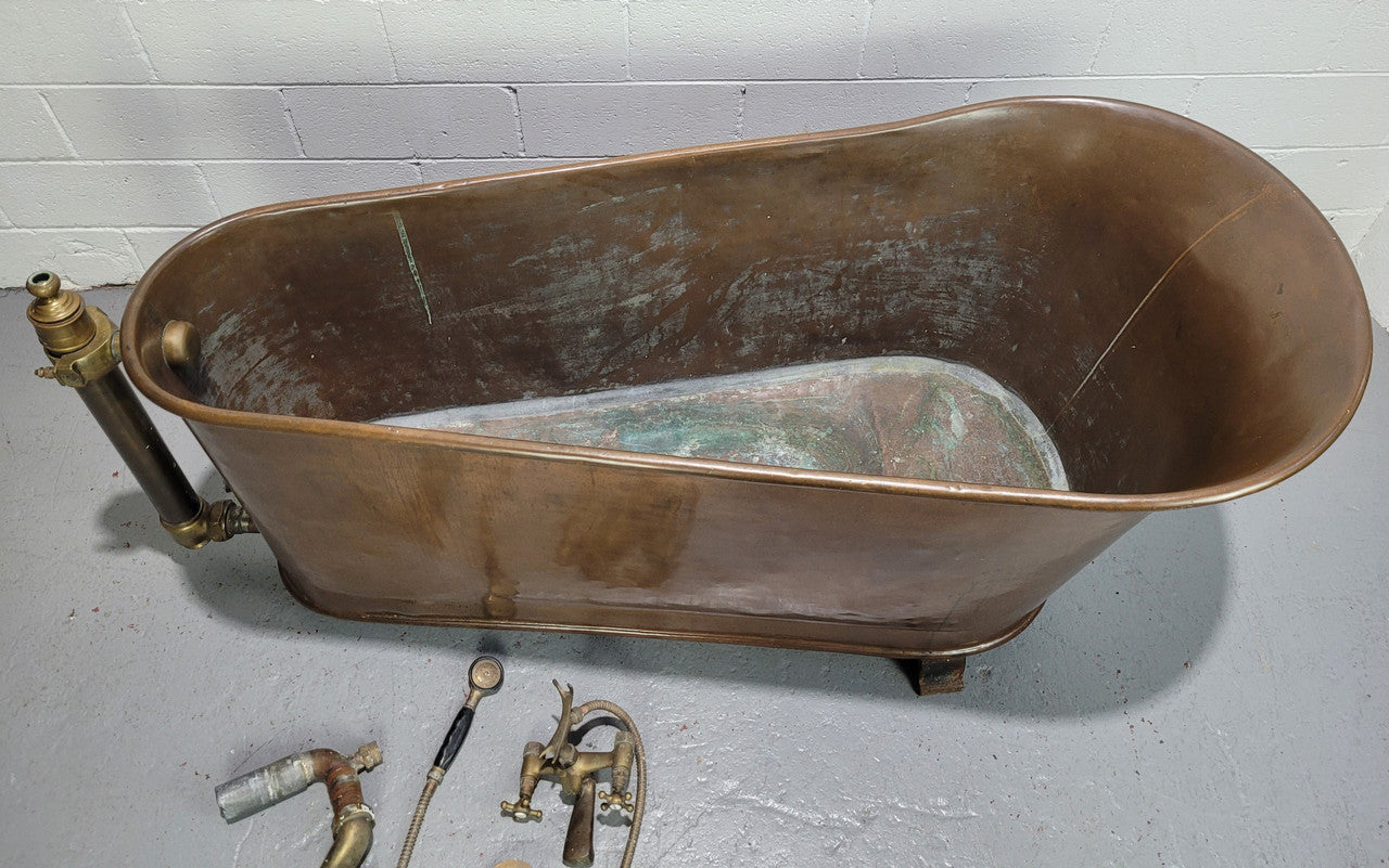 Sourced from France a rare full copper Antique bath tub on feet and includes an overflow, fittings, taps ect. In good original condition.