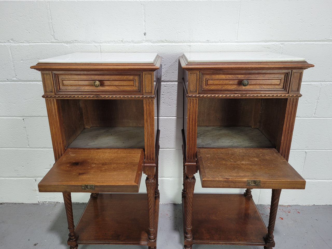Pair parquetry Walnut bedside cabinets with white inset marble tops. In good original detailed condition.