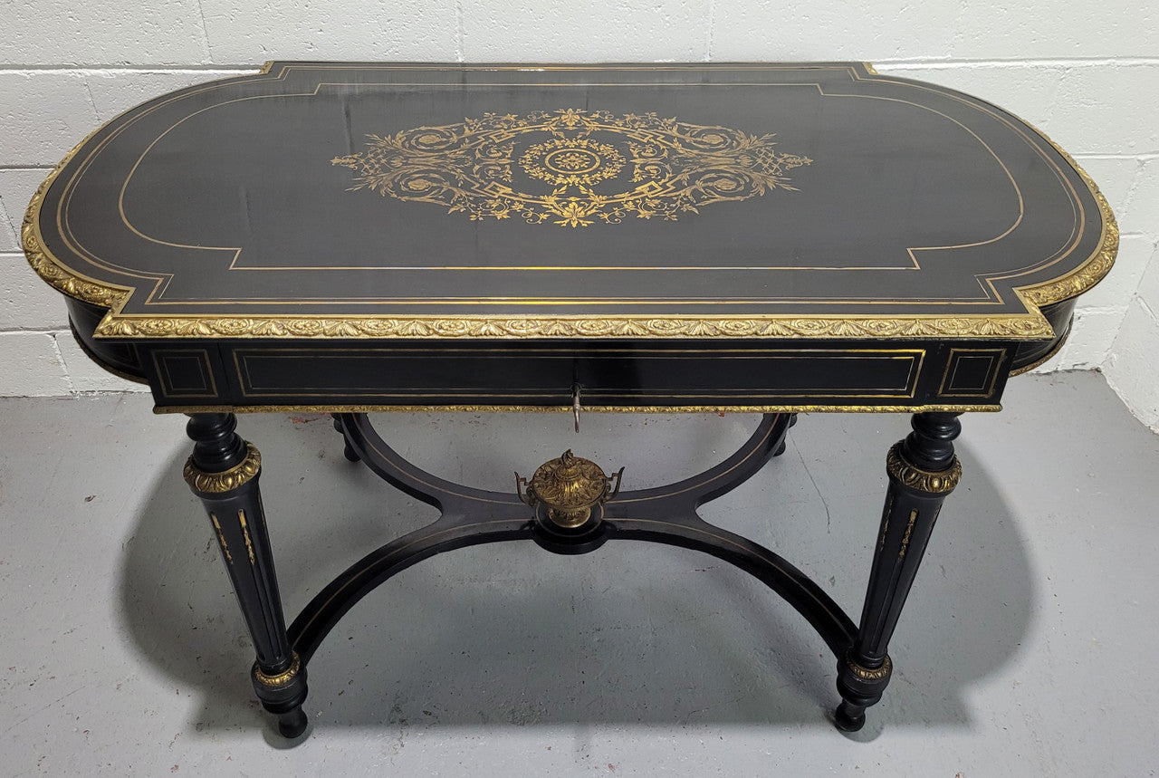 19th Century Napoleon III boulle ebonized centre table. Beautiful decorative mounts and has a drawer on one side. In good restored condition.
