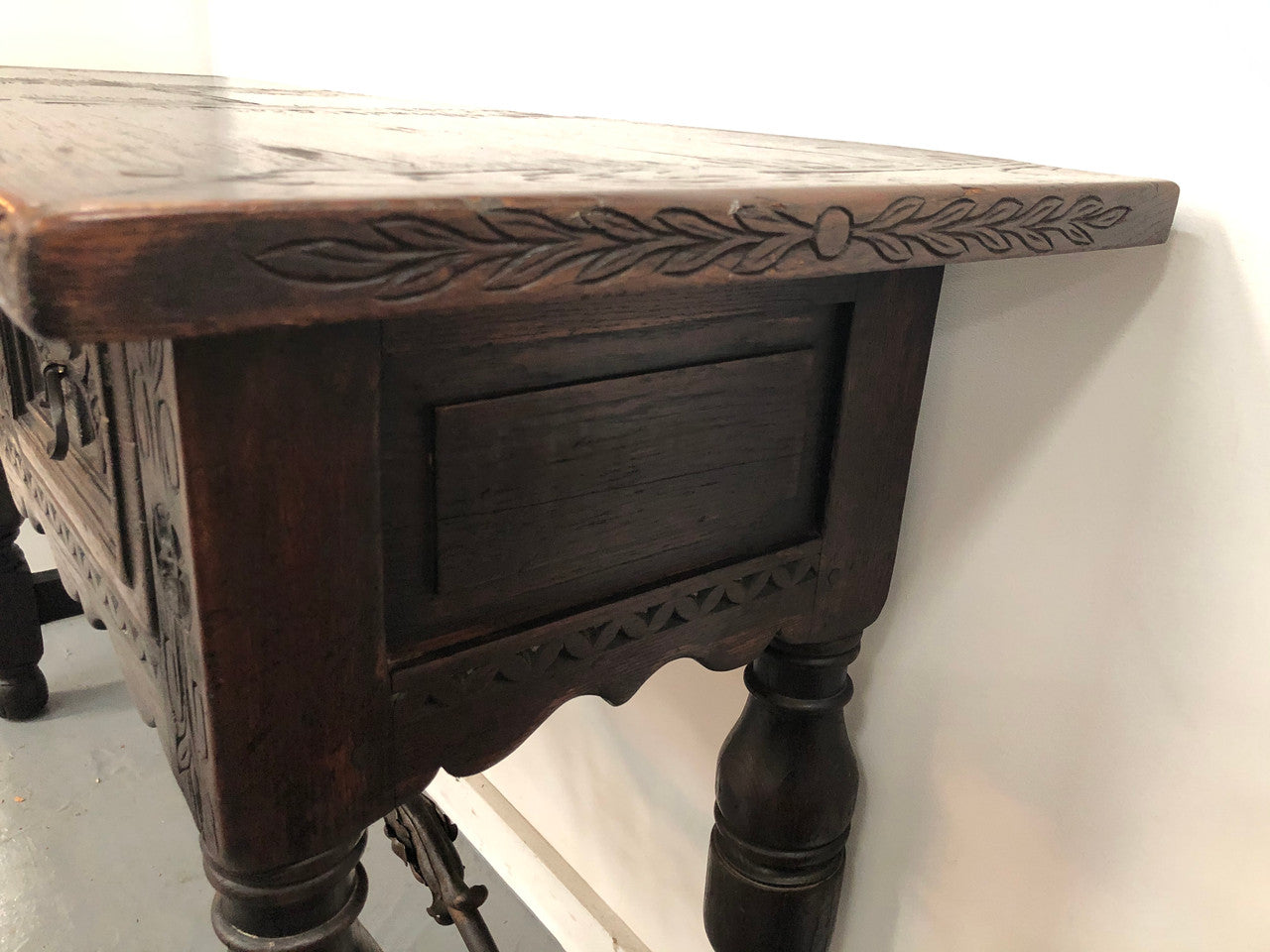 Spanish late 19th century carved oak three drawers console/side table. Superb wrought iron undercarriage. In good condition. Circa 1900's.