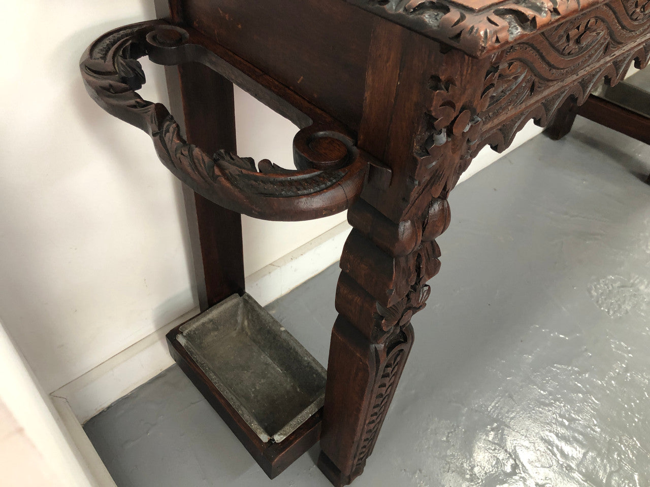 Superb 19th Century Gothic style hall/console table. It has umbrella and walking stick holders on both sides. In good original detailed condition.