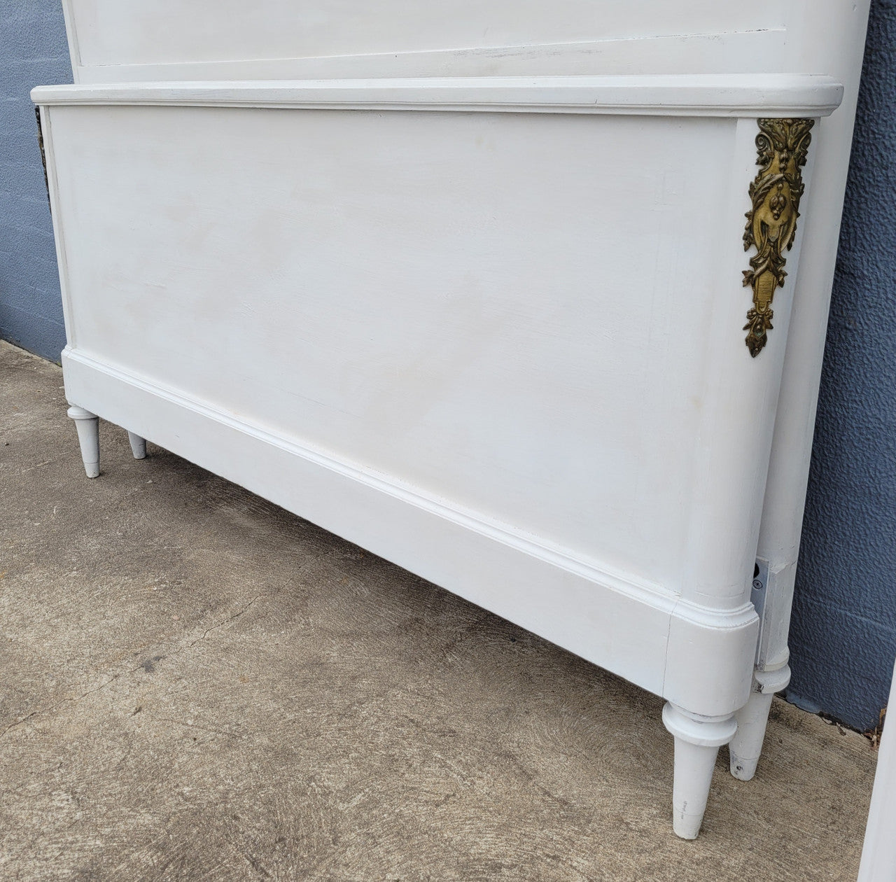 French Louis 16th style chalk painted queen size bed with gilt decorative mounts and includes custom slats. It has been sourced from France and in good original condition.