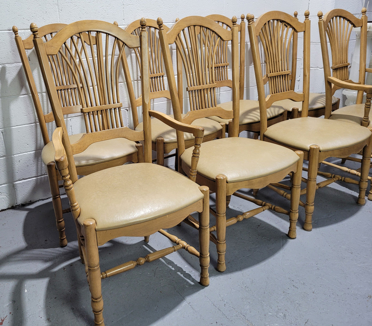 French country style set of six dining chairs and two carvers with leather seats. They are all in good original detailed condition.