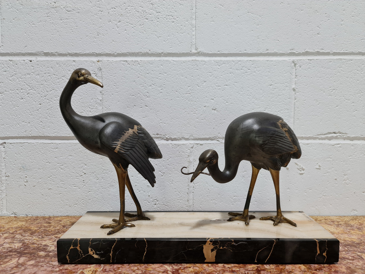 Fabulous French Art Deco cold painted spelter Ibis birds on a stylized Art Deco marble base. Signed "Rochard" circa 1930's. In good original detailed condition.