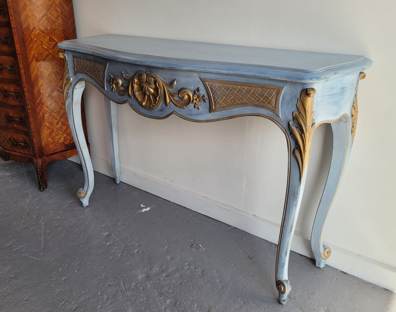 Stylish Louis 15th style console table with chalk paint and gilded highlights. They have been sourced from France and is in good original condition.
