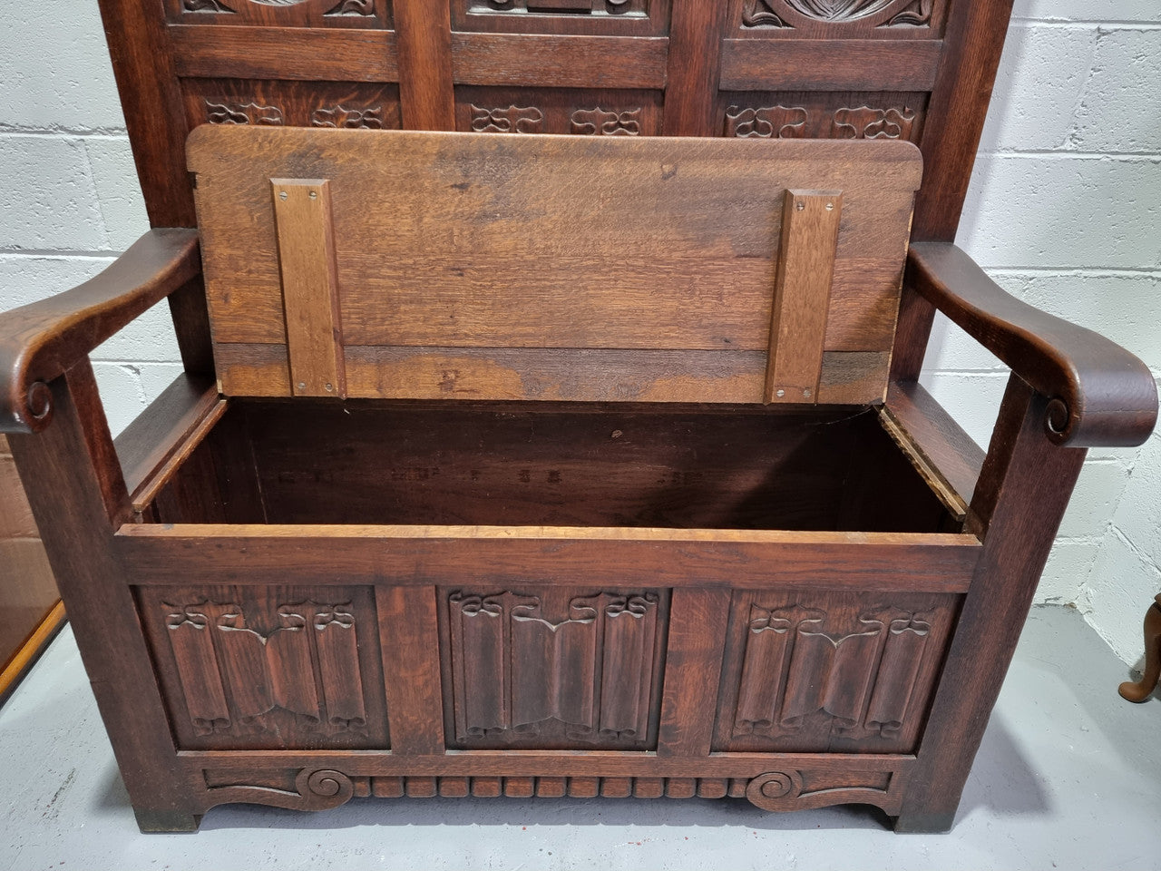 Decorative and nicely carved French Oak 19th Century hall seat with lift up lid for storage. Beautiful details and in good original detailed condition.