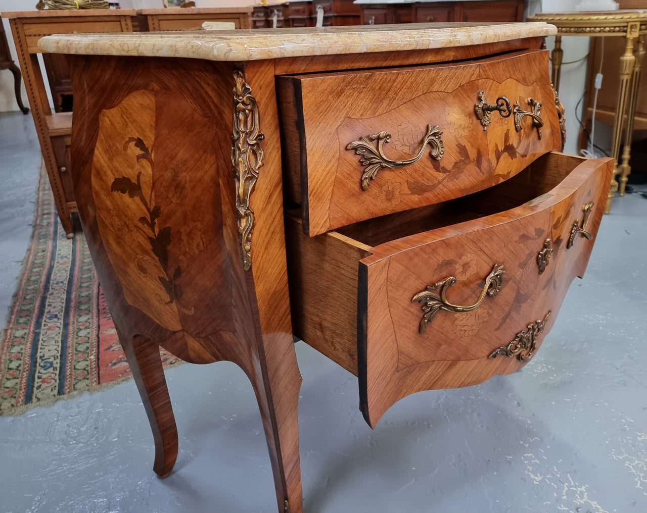 Fabulous French petite inlaid two drawer commode with ormolu mounts and lovely marble top. It is in good original detailed condition.