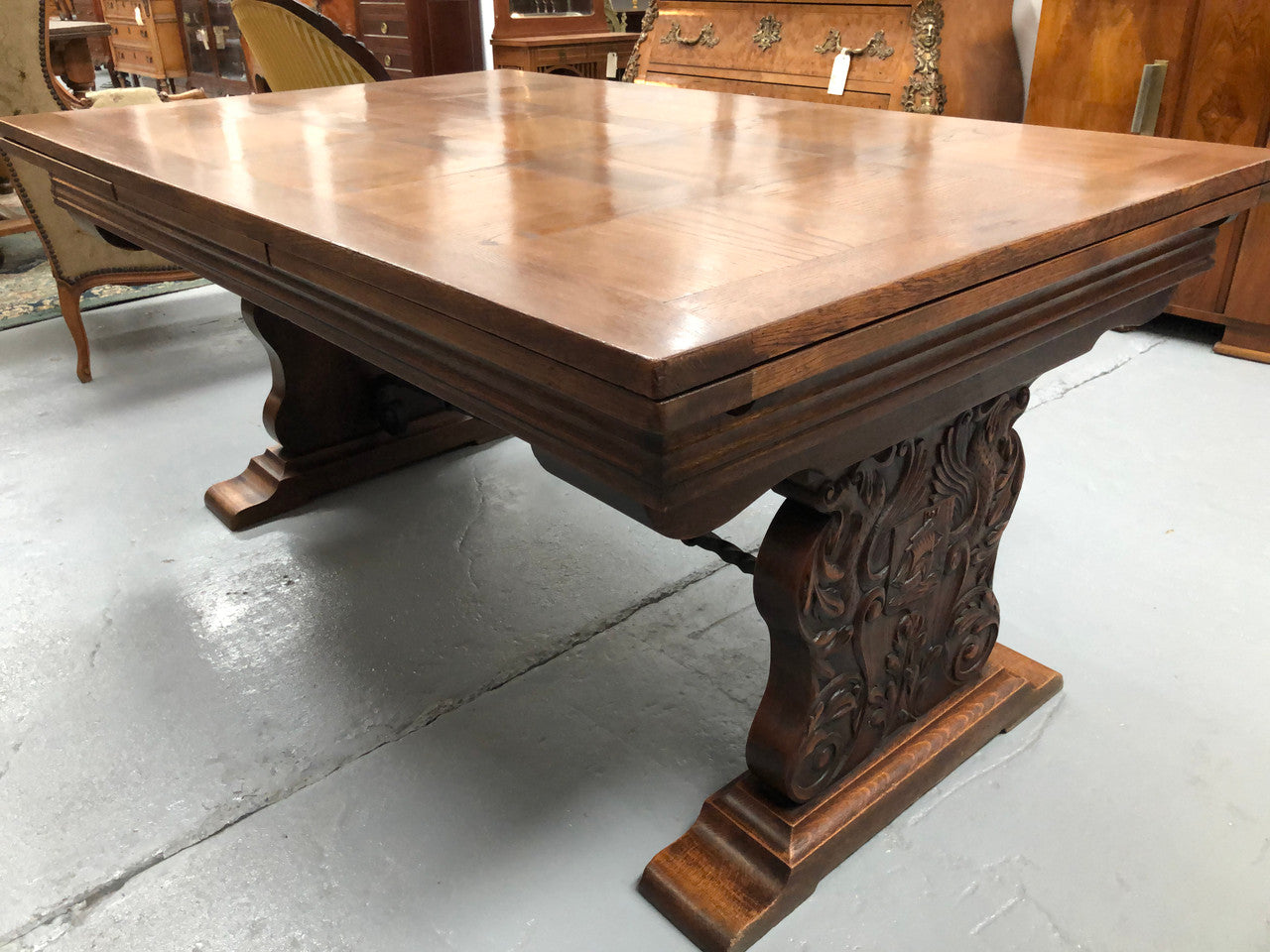 A beautiful French oak, Spanish style parquetry top extension table, with amazing carving and lovely details in very good condition.