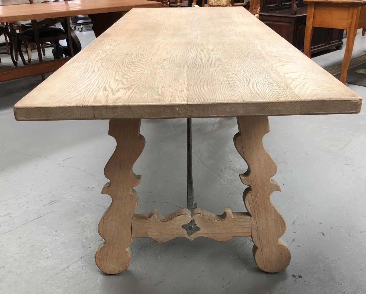 Limed French Oak Farmhouse table with decorative iron base. In good original detailed condition.