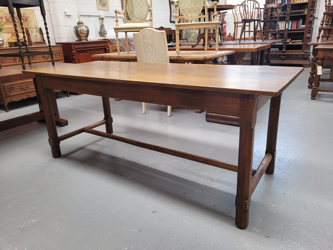 Stunning French oak stretcher base table, that has been sourced from France. It is in good original condition. Please see pictures to form part of the description.