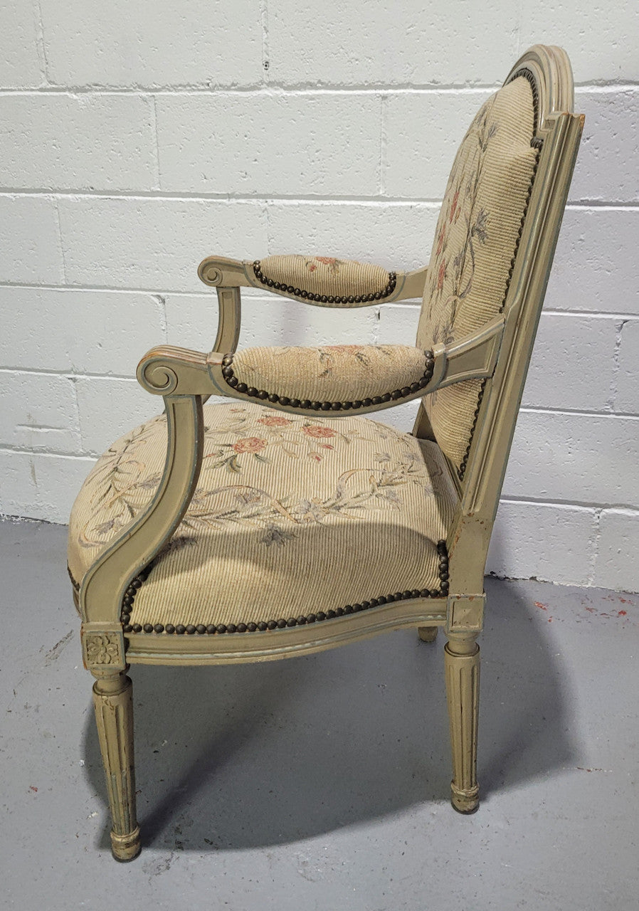 Lovely French Louis XVI style painted and Tapestry upholstered fauteuil. In good original condition, and very comfortable.