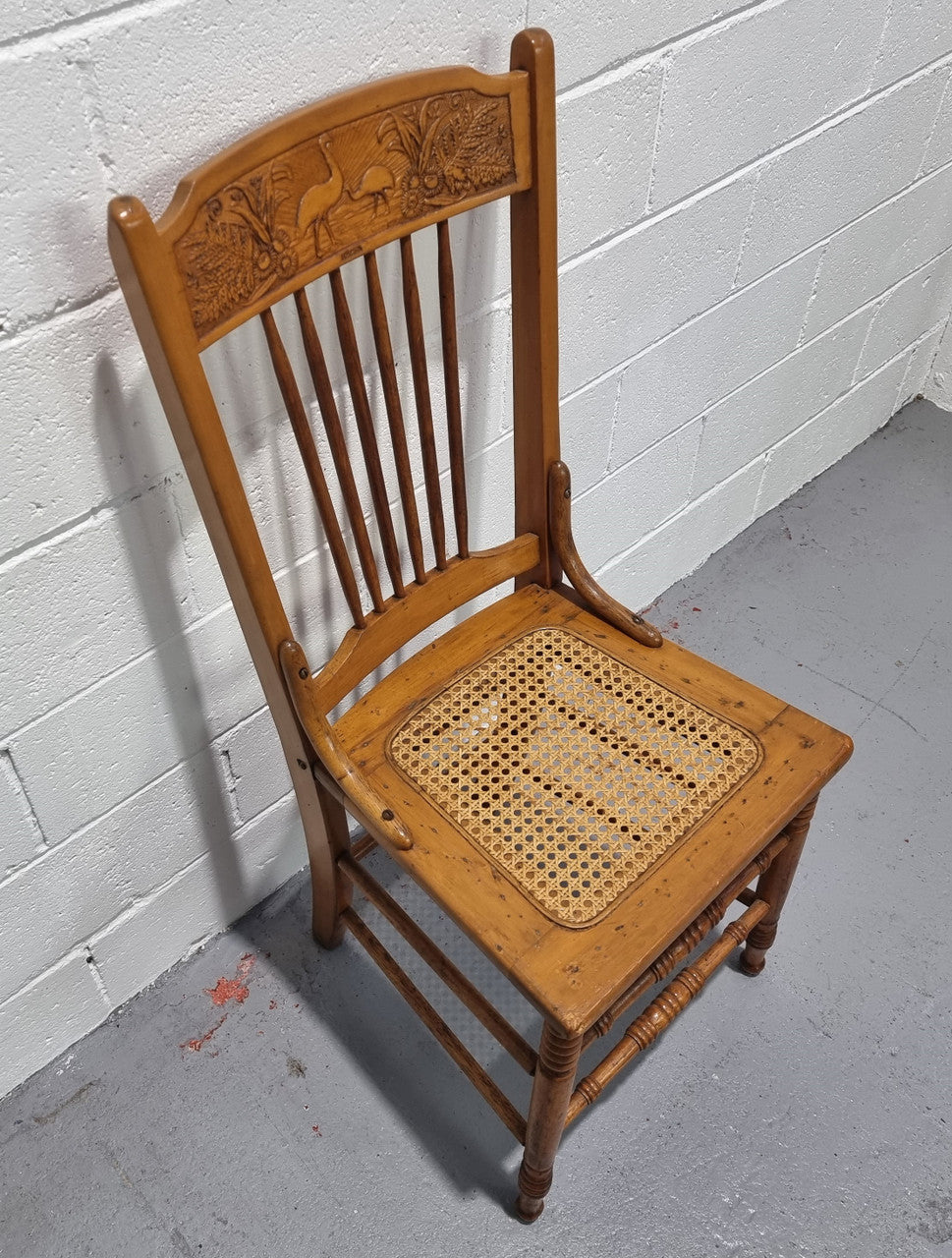 Australian Emu chair with cane inset seat. In good original condition.