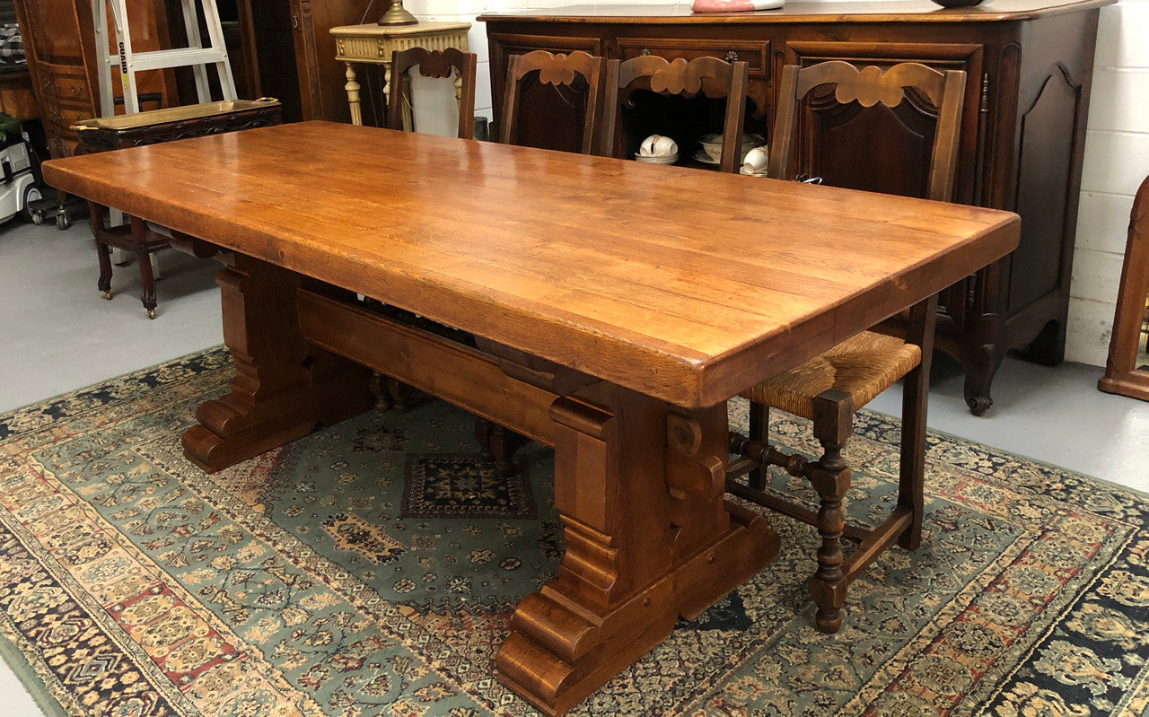 French Farmhouse table with a beautiful thick plank top and stretcher base. Can seat 8-10 people comfortably and is in good original detailed condition.