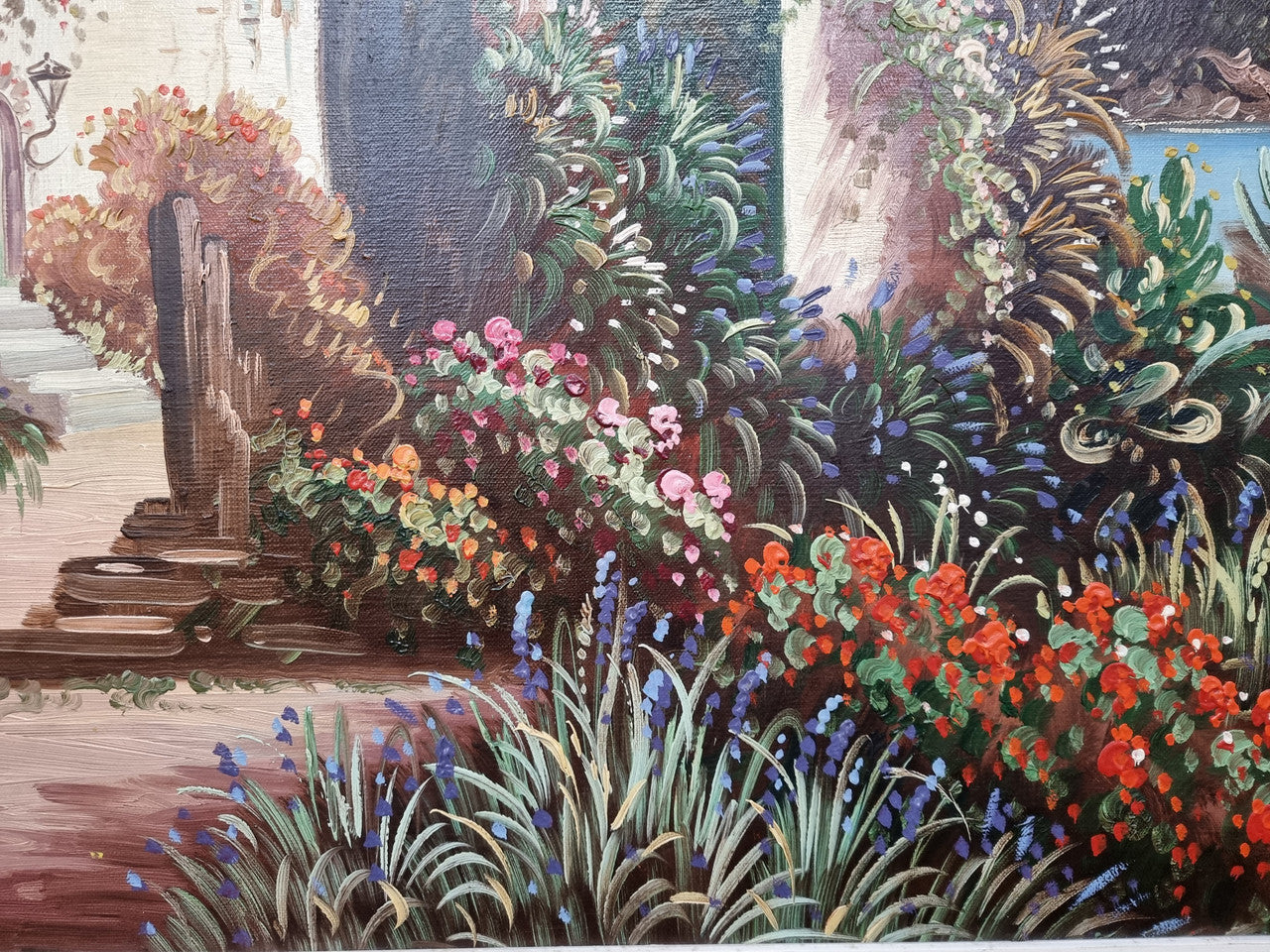 Sourced in France a colorful signed oil on canvas " Mediterranean coastal scene" in a decorative gilt frame. It is in good original detailed condition.