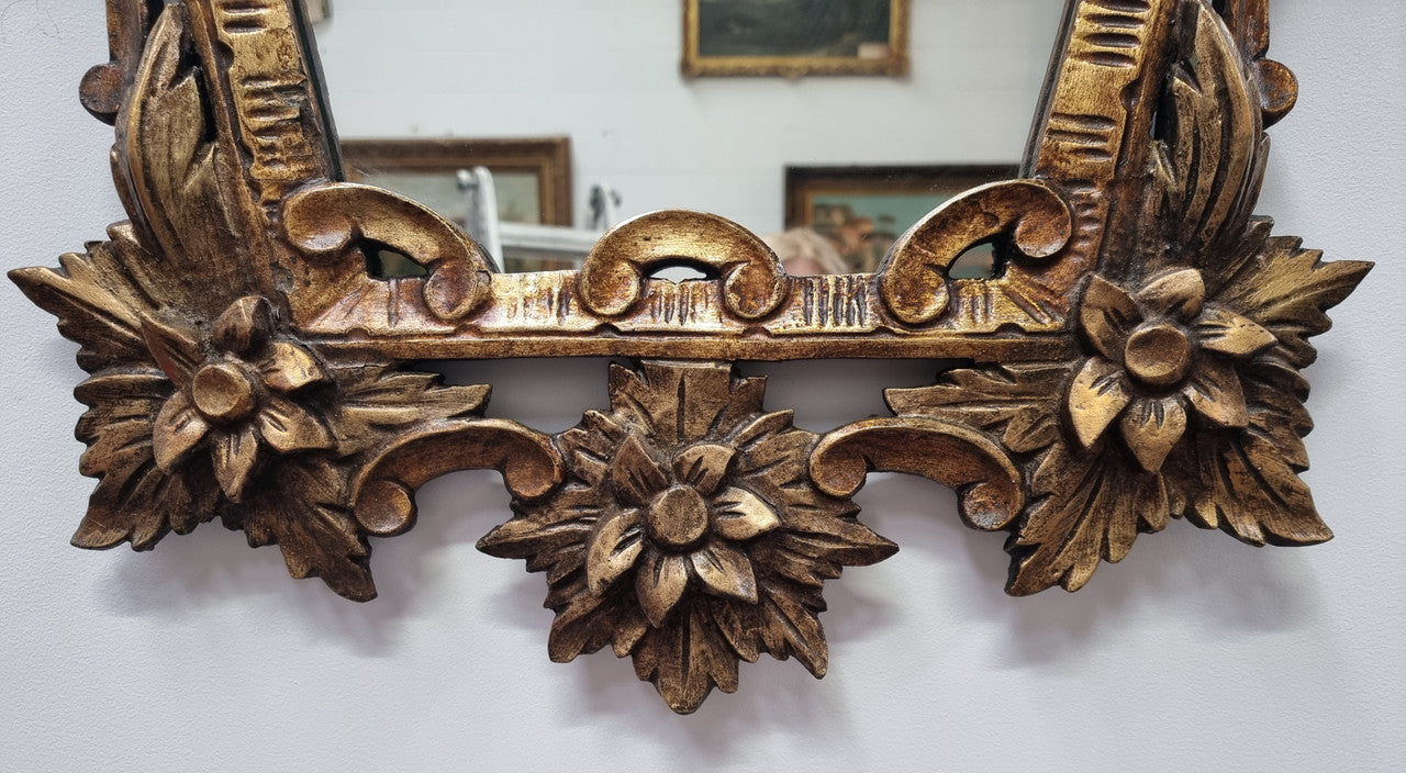 Interesting Italian gilt decorative framed mirror featuring birds. In good original condition.