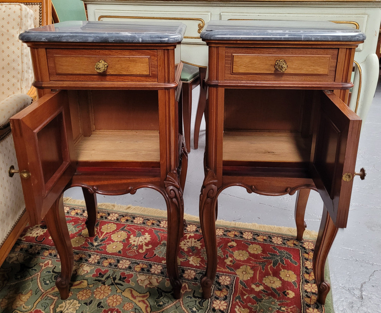 Pair of Walnut Louis XV style grey marble top bedside cabinets. Single drawer, one cupboard and lovely French cabriole legs. They have been sourced from France and are in good original condition.