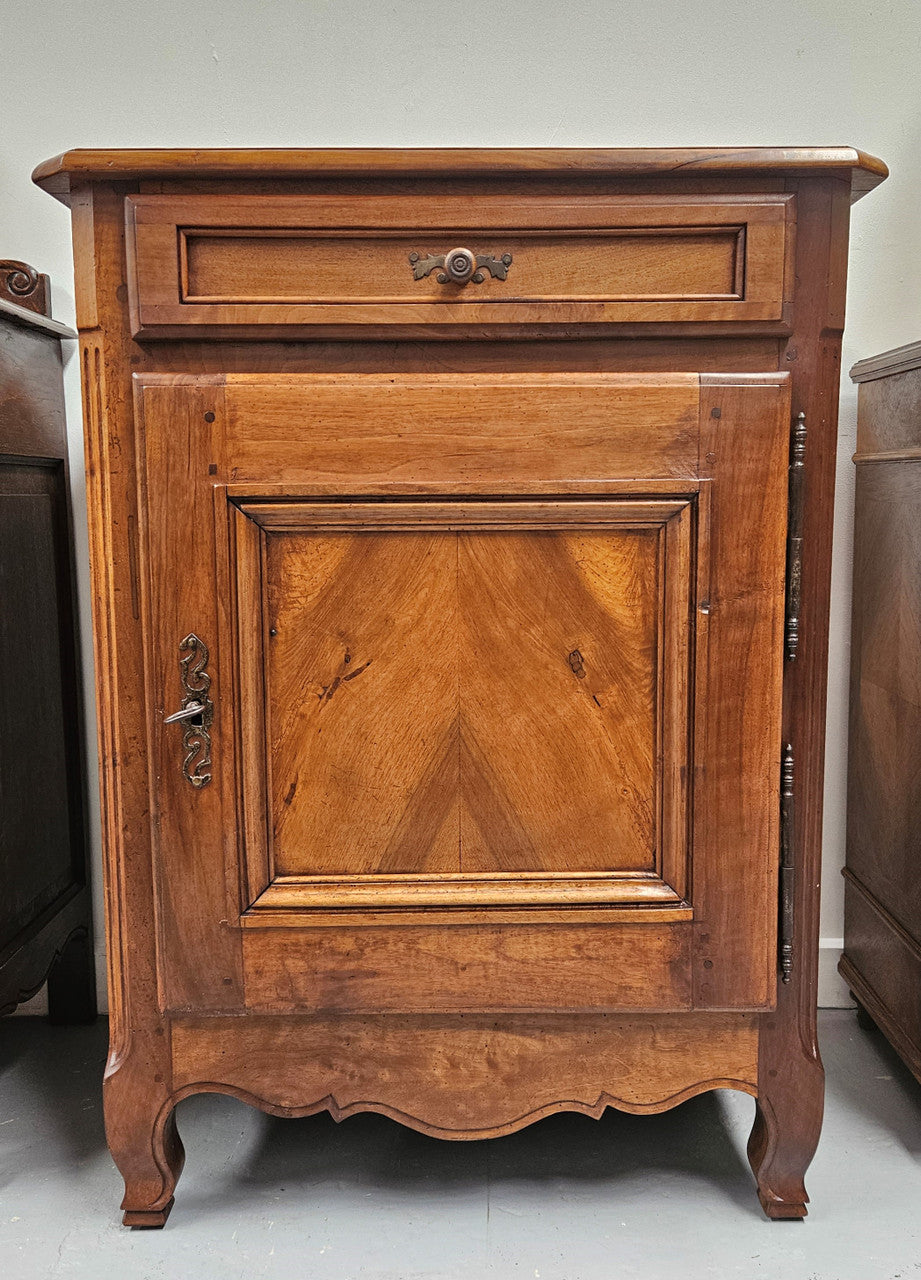 Louis XV style French walnut cupboard with one drawer & two shelves. Circa: 1930's. It is in good original detailed condition and has been sourced directly from France.