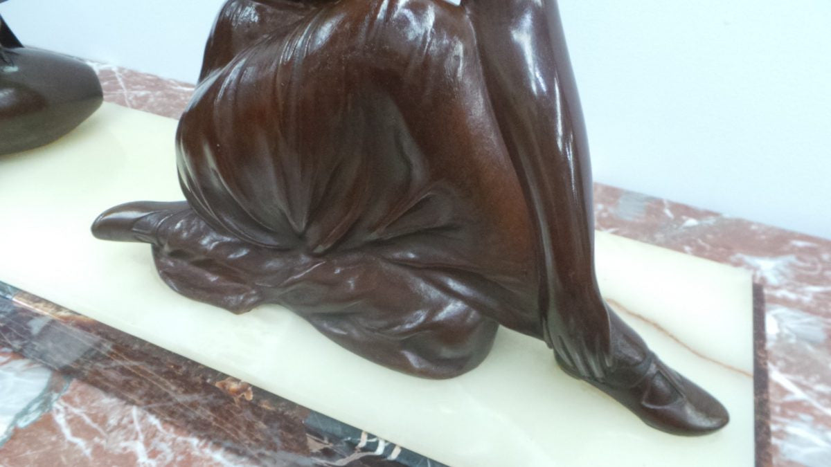 An Art Deco bronze statue with brown patina, of a lady and parrot on a marble base. Signed by Italian Sculptor A Trefoloni, an important and highly regarded sculptor. The statue is in very good condition.
