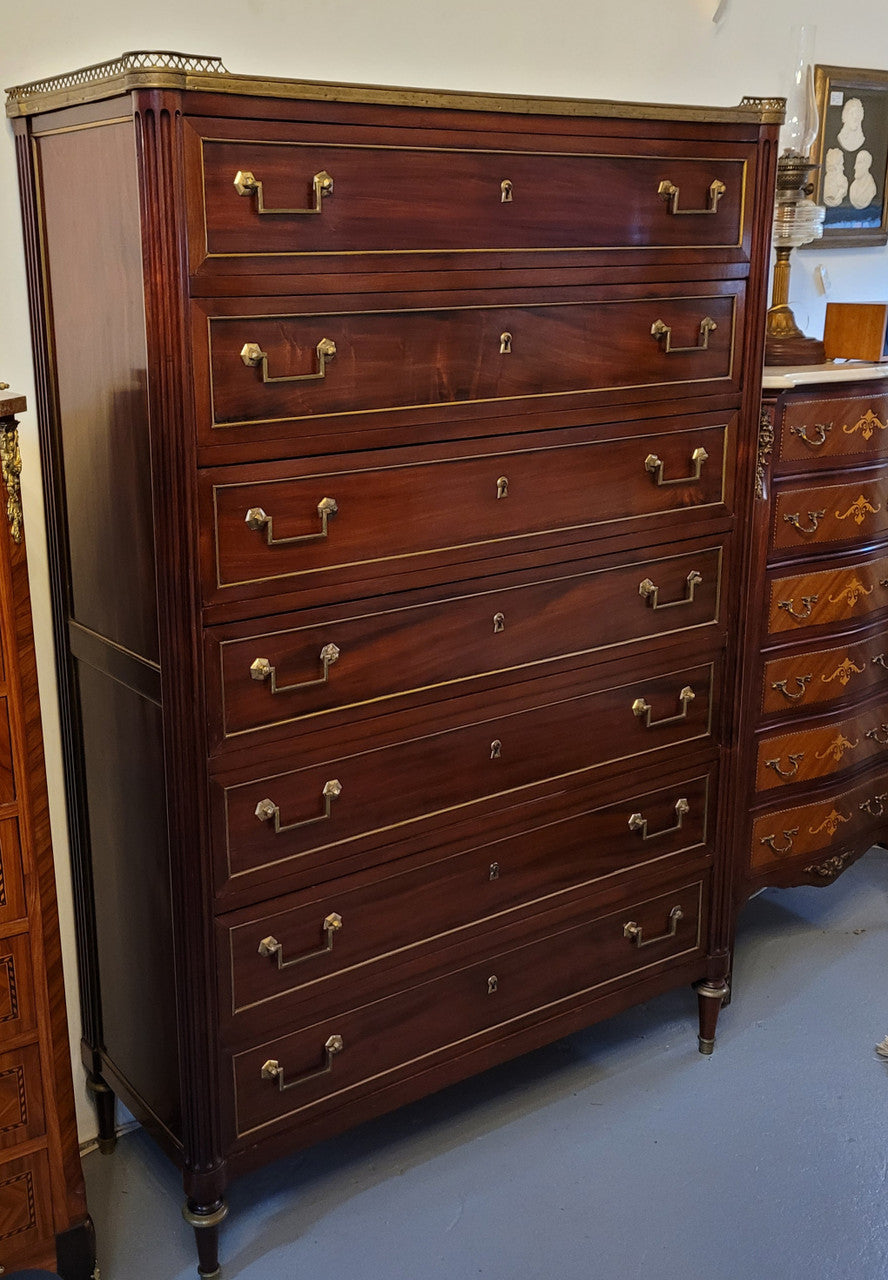 Absolutely beautiful French Empire seven drawer semainier with a lovely white carrara marble top and amazing bronze handles. It has its original key and is in good original detailed condition.